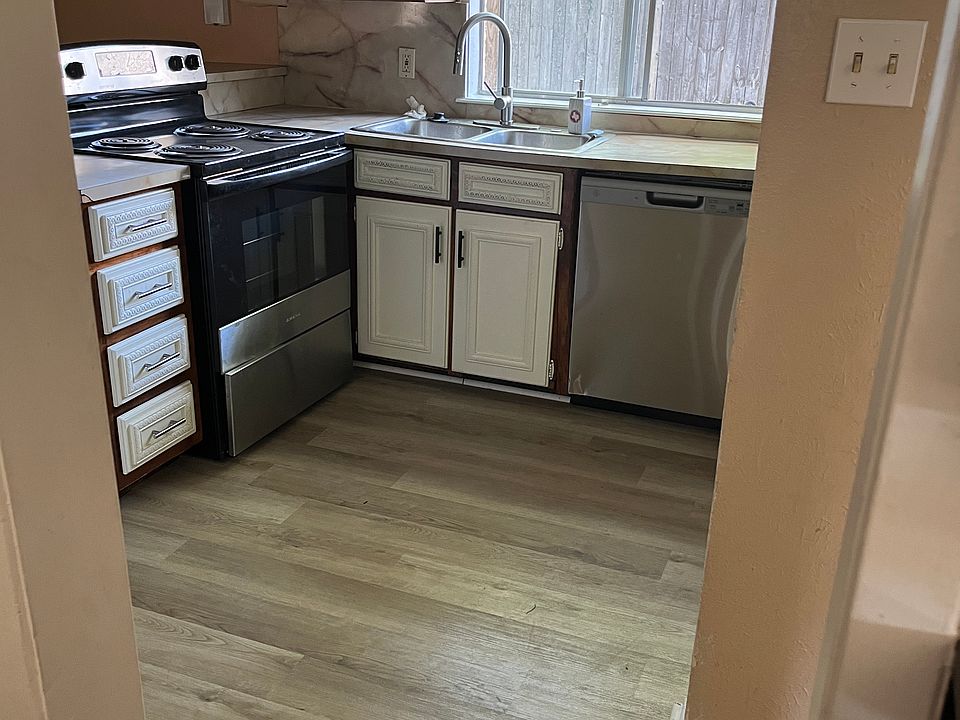 KITCHEN - appliances included are Elect. Stove, Dishwasher, Fridge.