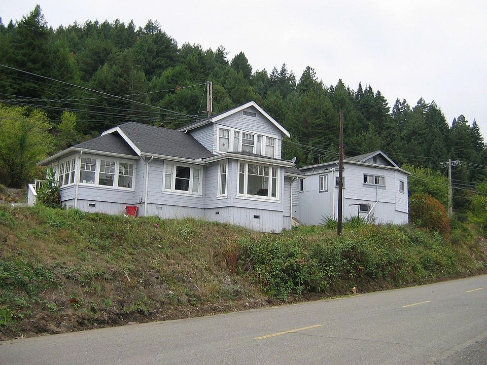 Rear View of Duplex and Two Single Family Homes-Cap Cod Style Sitting on hill!