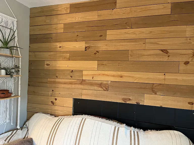 Some photos of the interior are old, this is a recent update on the fireplace wall. The mantle was removed and the wall paneled with wood.