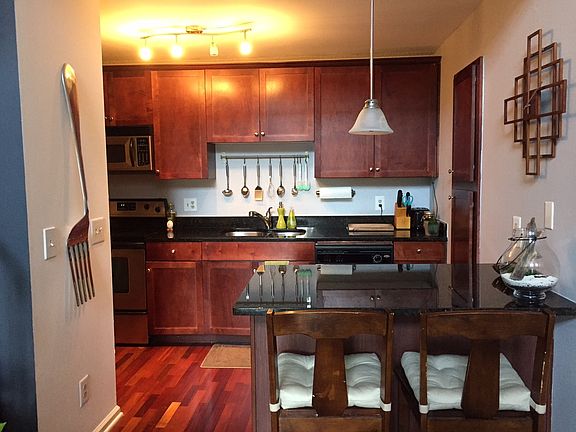 Kitchen with attached laundry on side