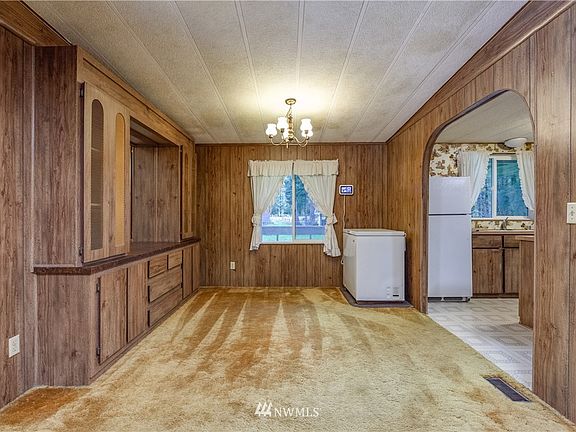 Dining room has built-in cabinetry. Digital display shows you the status of the solar panel system.