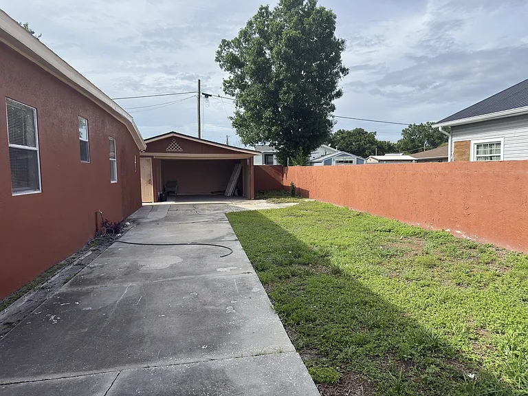 Back yard facing garage