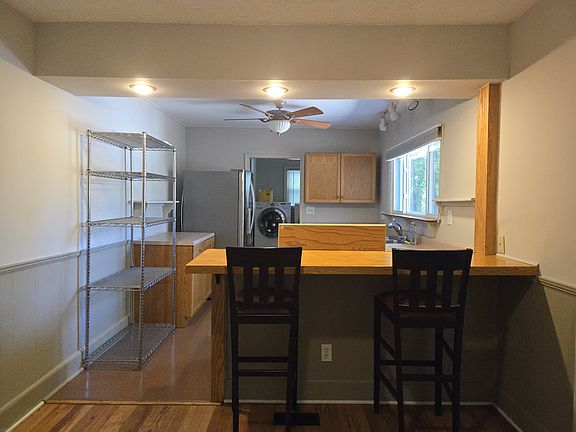 Kitchen with bar; laundry room in back