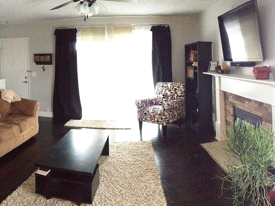 Main Family Room. Large slider next to front door allows for a lot of natural light and airflow off of the private, fenced in outside area