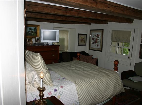 Master with original doors and walkout to mahogany deck overlooking two ponds