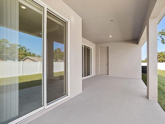 Your interior opens to outdoor living space on your spacious covered lanai - Savannah by Highland Ho