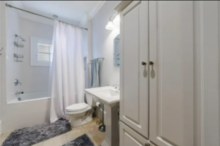 Secondary bathroom includes built in storage