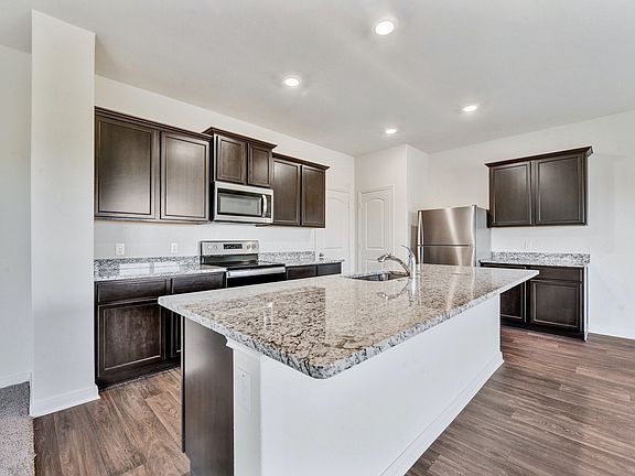 The kitchen comes with a full suite of energy-efficient appliances
