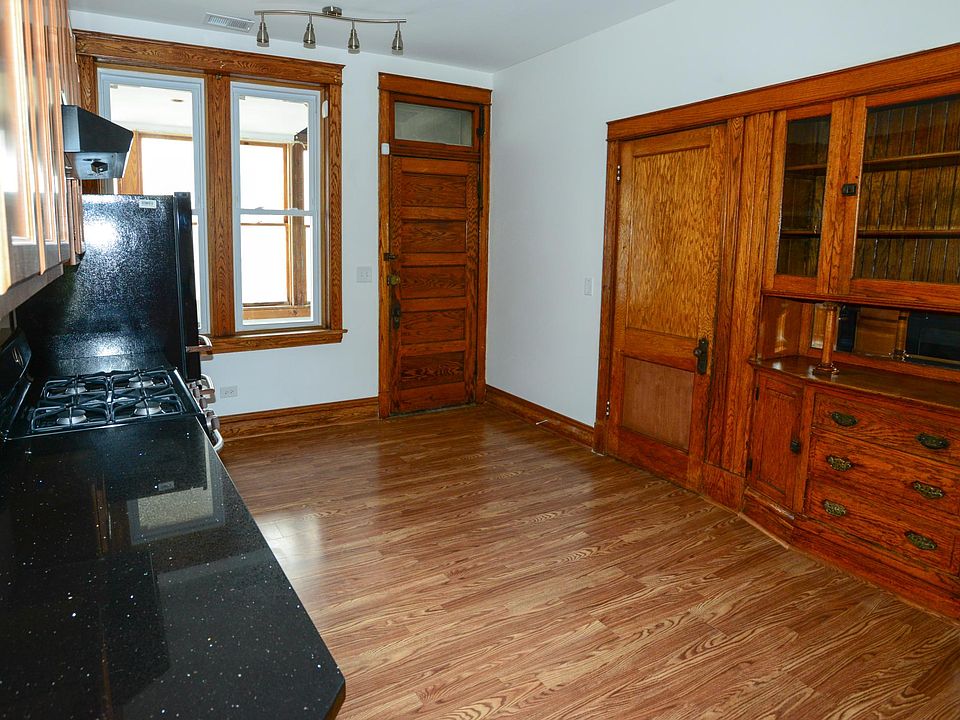 Vintage 1900s red oak hutch is the centerpiece of the kitchen.
