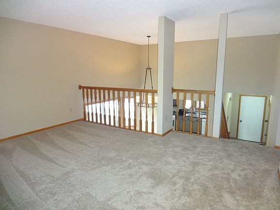 The upper level living room is spacious! Featuring all new c