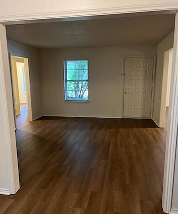 Looking from kitchen to the living room and front door.