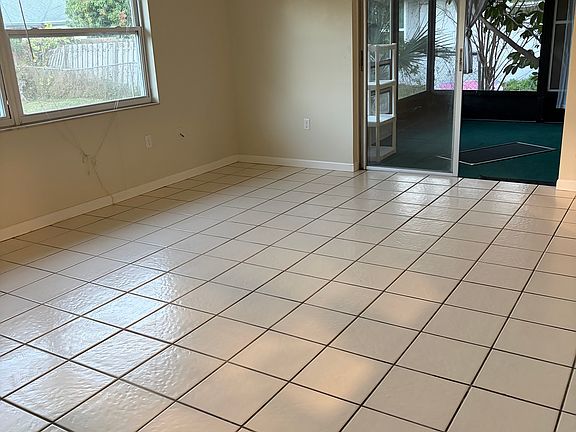 Family room opening up to screened patio
