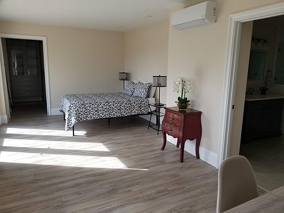 Large primary bedroom with walk in closet.
