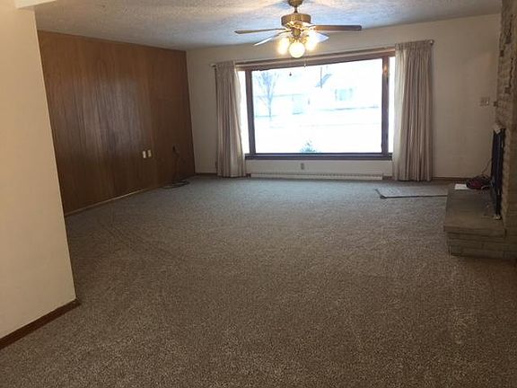 Dining room with Kitchen on Left and looking into Living room