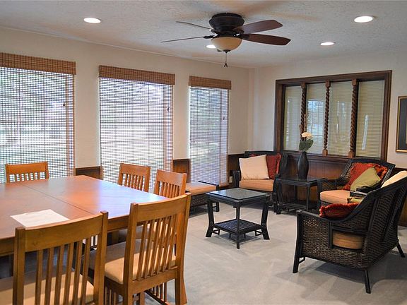 The Family room is located in the back of the home with serene views of the beautiful back tree filled property.