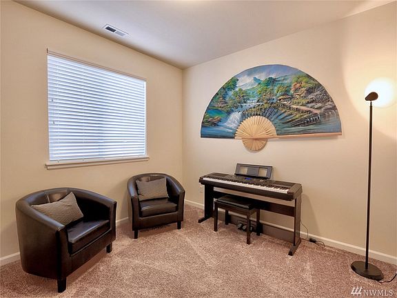 Lower level bedroom/den with closet is across the hall from the 3/4 bath. Perfect for guests or in-laws.