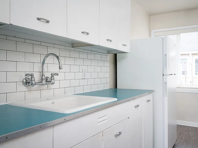 Clinton Court| Kitchen with White Appliances