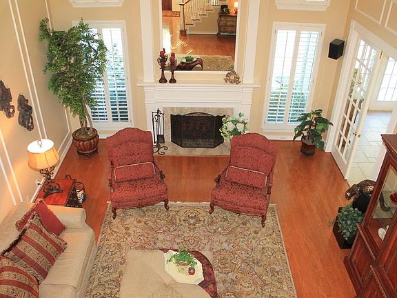 A look from up above shows off the wood flooring, fireplace and picture frame molding.