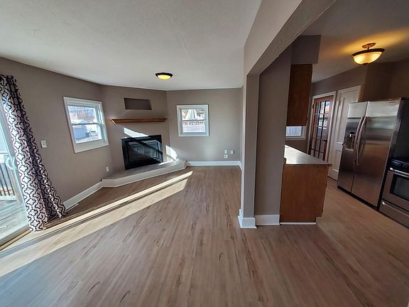 Main Level - Family / Dining Room with Fireplace and Kitchen