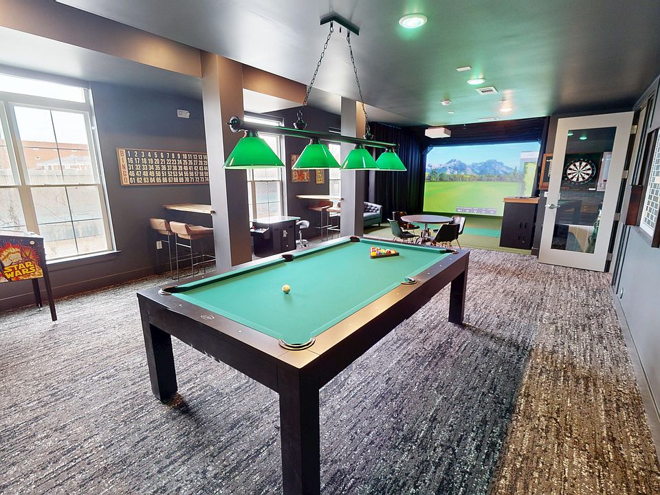 Unwind and entertain in this upscale games room, designed for endless fun and relaxation.