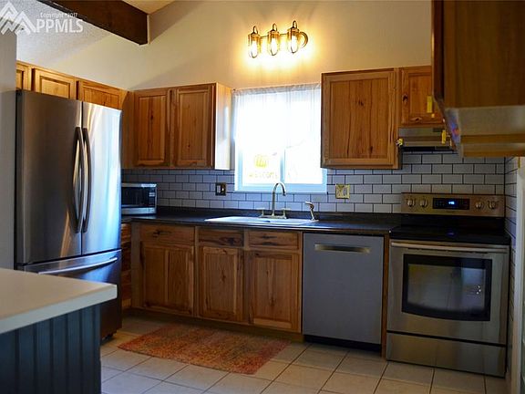 Newer cabinets and appliances.  Tile floor.