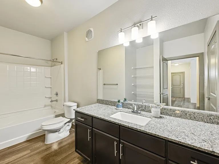 Enjoy the bright vanity lighting in the spacious bathroom.