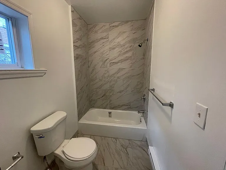 1st floor bathroom with shower and tub