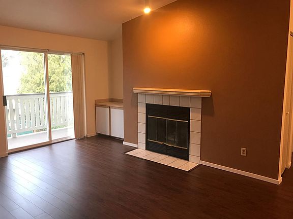 Living Room Area w/ Fireplace and Patio