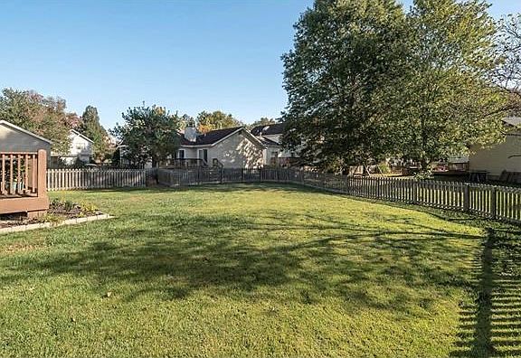 Nice Size Fenced Level Backyard with Deck.