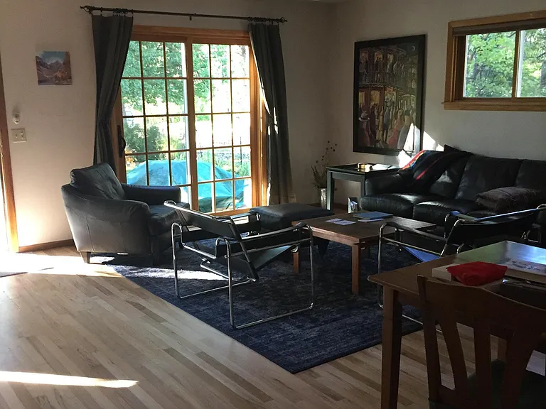 Living area with French doors to patio, dining area