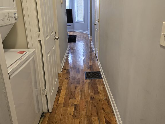 Hallway, unit comes with stackable washer & dryer. Owner pays for water.