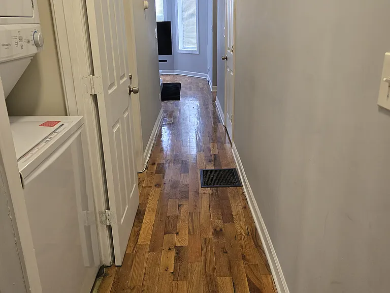 Hallway, unit comes with stackable washer & dryer. Owner pays for water.