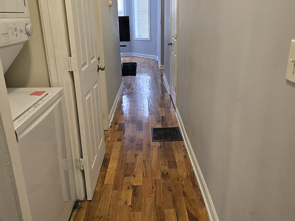 Hallway, unit comes with stackable washer & dryer. Owner pays for water.