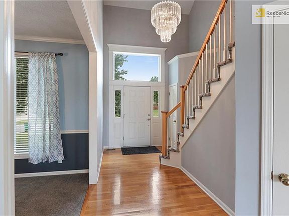 Enter to soaring ceilings and hardwood floors