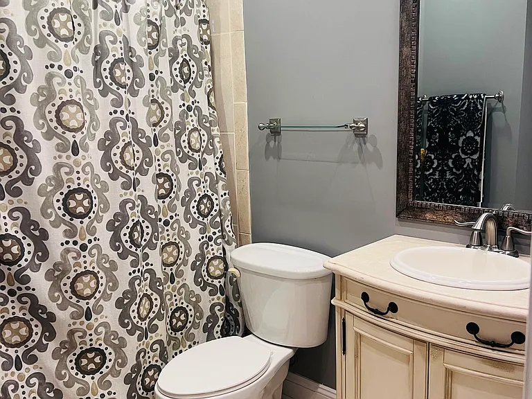Guest bathroom with tub and shower