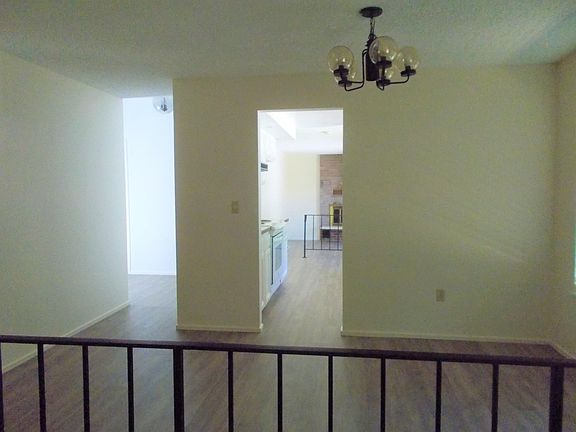 View from living room into dining room and kitchen
