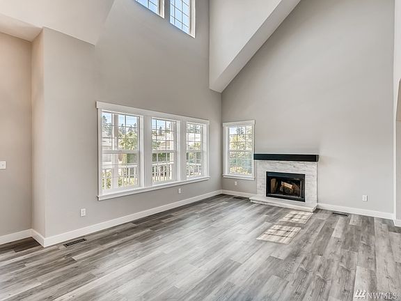 Soaring ceilings, all new flooring, new fireplace surround and mantle