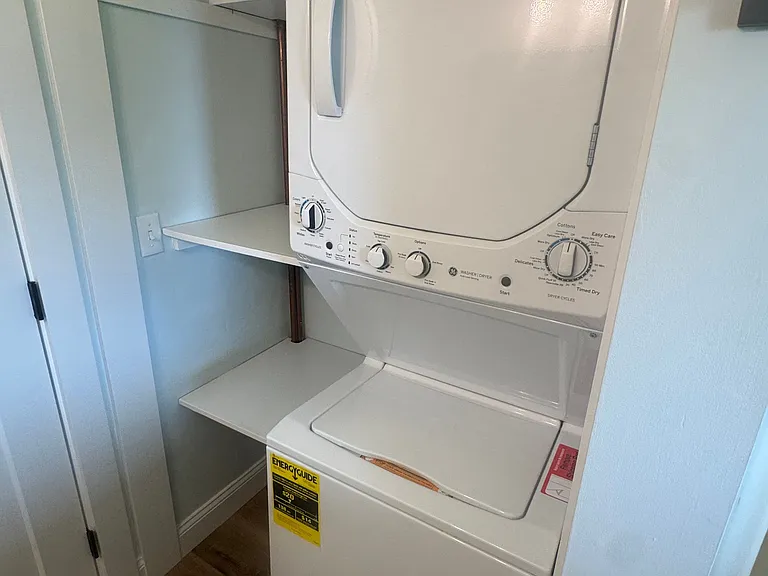 In unit stacked laundry in Bathroom