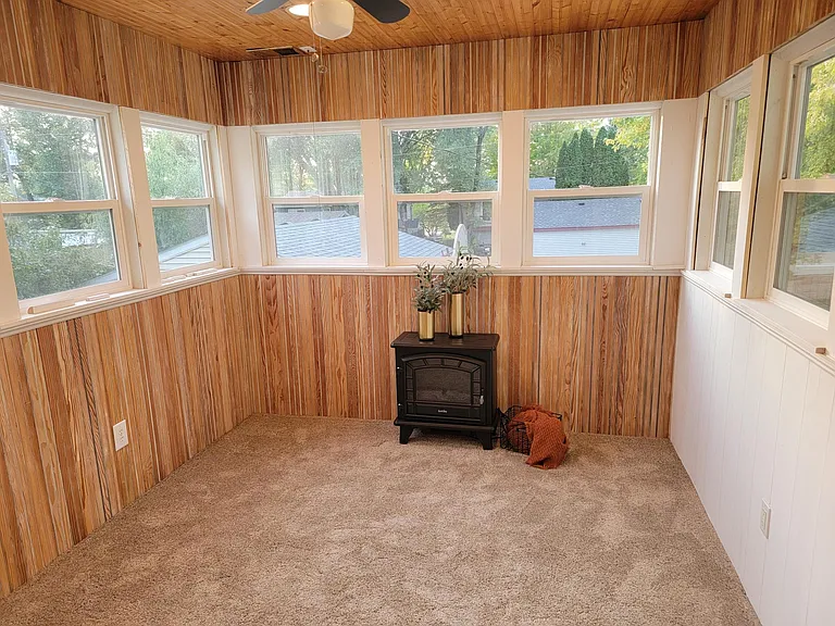 3 season porch walks out to large deck