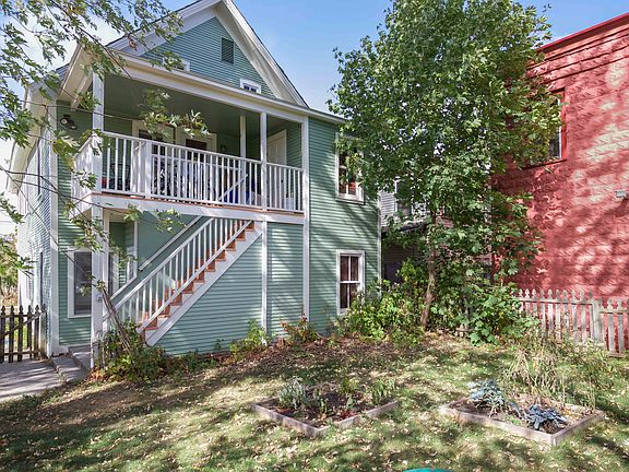 backyard with raised garden beds shared