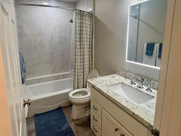 Full bathroom with tub and shower