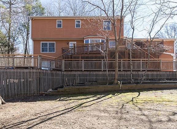 Exterior picture of the back of 670 Broadview. Notice their are two levels of decking off the home for entertaining both small and large gatherings.