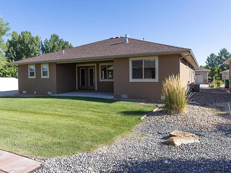 Back of house with covered patio