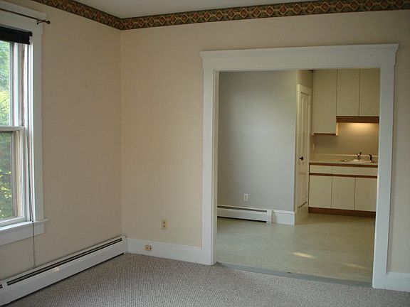 living room opens into kitchen