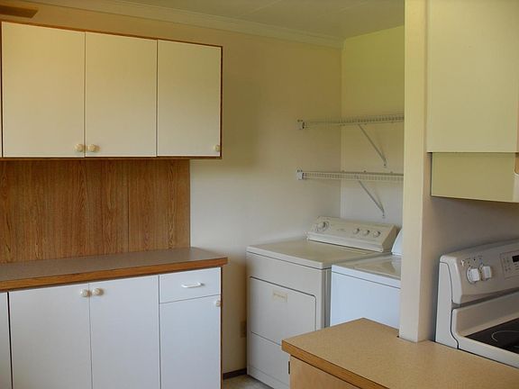 Storage pantry & laundry nook. Tenants supply washer and dryer.