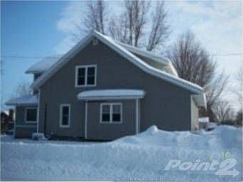 REO World 361 1st St Gaylord Side View