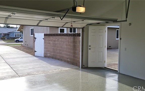 Completely finished garage (including floor) featuring new doors and opener!
