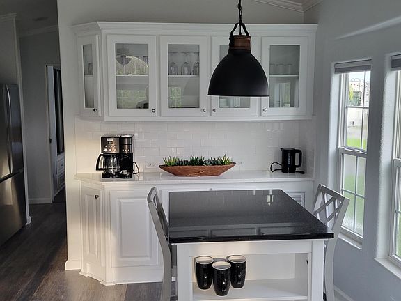 kitchen table with built in storage cabinet.