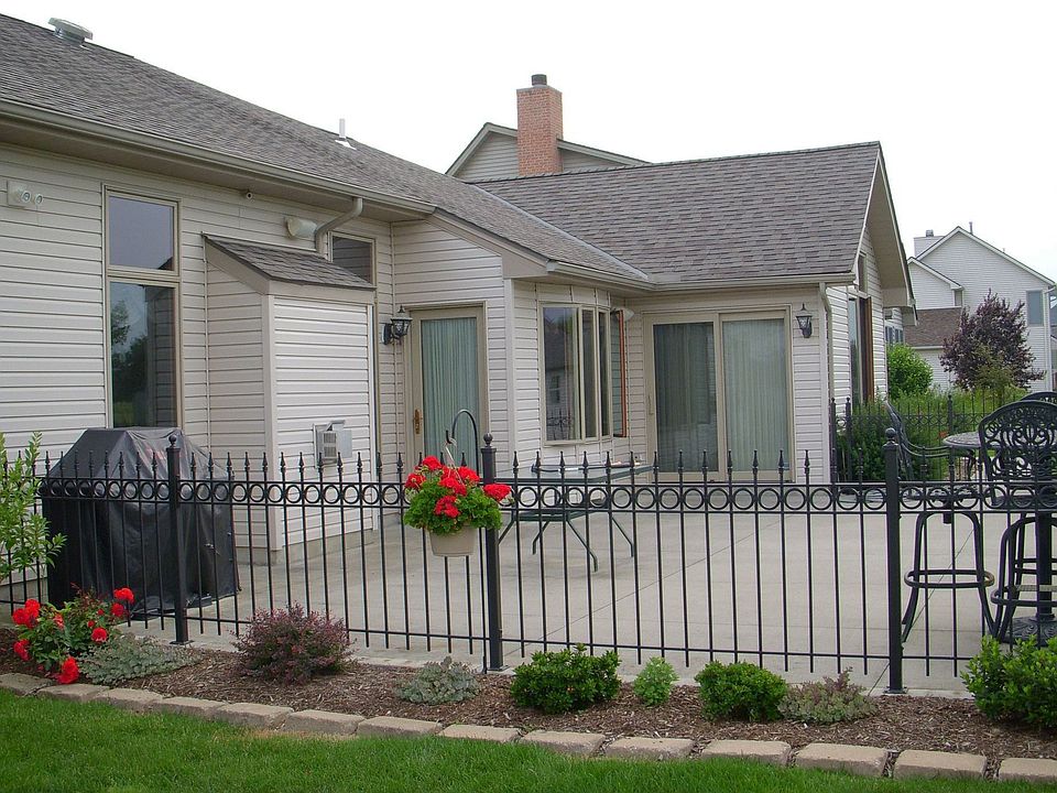Back patio with wrought iron surrounding it
