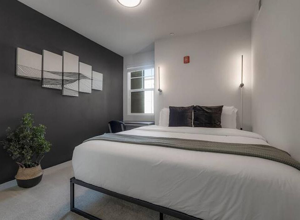 Snuggle up! This room has a king-size bed with a desk and chair.